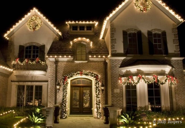 Elegant warm white Christmas lighting with garland and wreaths